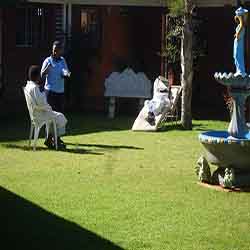 Health care worker and patient in the courtyard